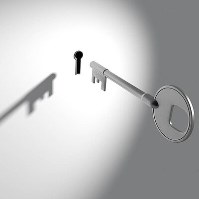 Key hovering in front of a keyhole