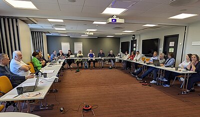 tekom Europe delegates, executive board and CEO sitting in a conference room